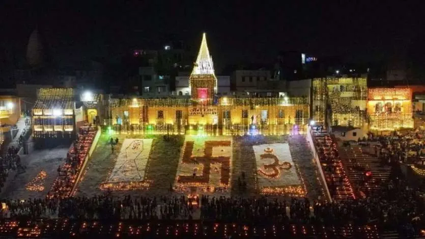 Ghat in Varanasi lit with lamps arranged in sacred symbols on Dev Deepawali